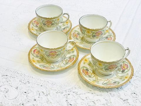 A set of 4 Small Floral Teacups & Saucers