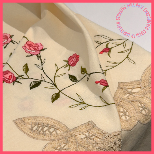 A beautiful embroidered linen tablecloth.  Vintage and pre loved, in very good condition.  Stems of pin roses with embroidered edges.  The colour is cream/ecru.  Diameter 164cm.  Afternoon Tea Tablecloth.  