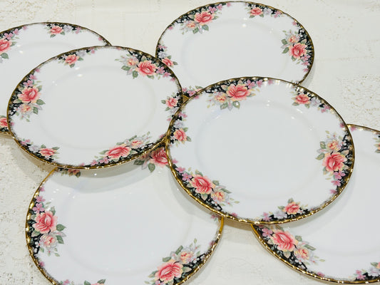 A set of 6 Royal Albert Lunch Plates in the Concerto pattern. &nbsp;Very good condition, would appear unused. &nbsp;White base colour decorated with pink roses and gilded rims.&nbsp;