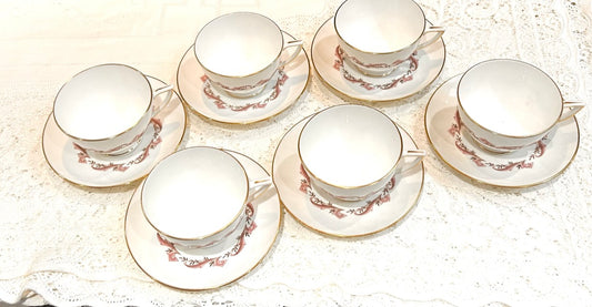 Minton Laurentian pattern Teacups & Saucers - a Tea set. This set would make a wonderful wedding or anniversary gift. The set is pre owned and vintage but comes in very good condition with minimal use. Manufactured circa 1955-69.  6 Teacups 6 Saucers 1 Sugar Bowl 1 Cake Plate