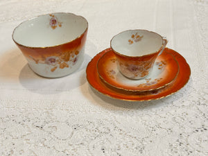 A pretty set of Victorian bone china made in England.  The set consists of a Teacup & Saucer with matching tea plate and original Tea Bowl.  White and rust colour way with a pattern of hand painted purple stemmed flowers.  Moulded edges.  No maker name but there is a number stamped.  Overall the set is in good condition, there is a hairline inside the teacup.  