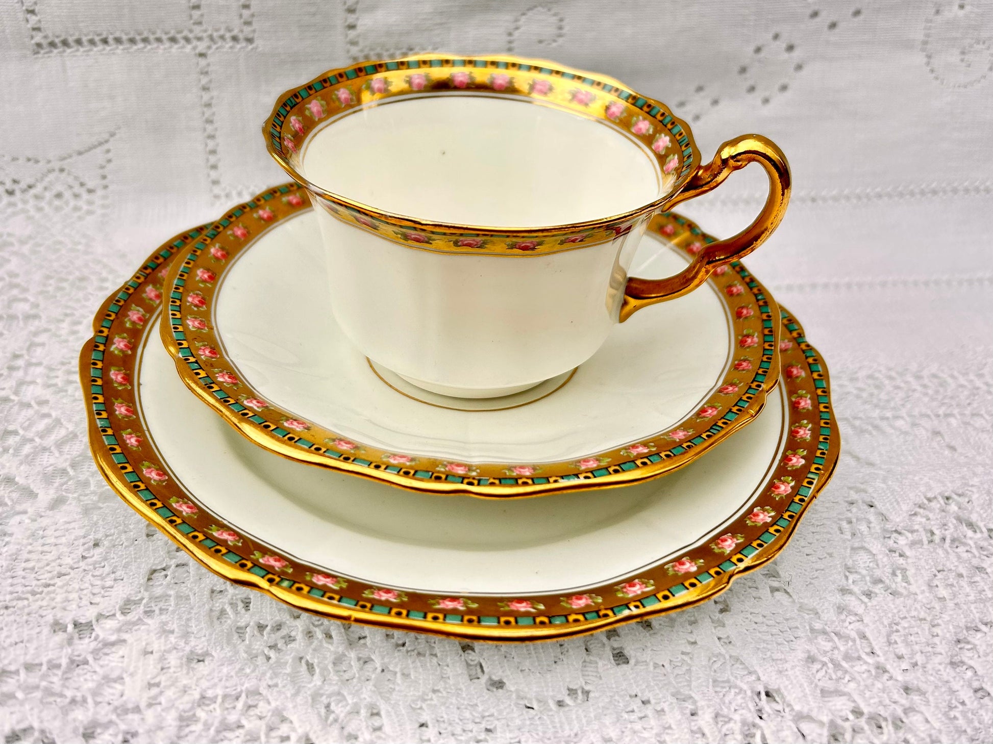 A pretty Vintage China teacup & saucer set with tea plate, white base gold rim pink roses E Hughes, England